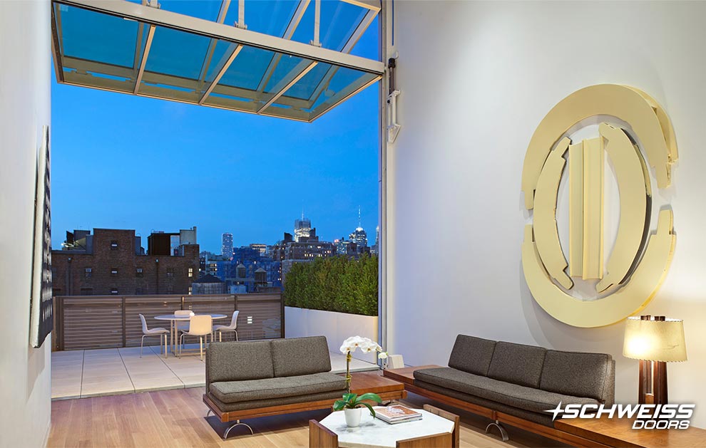 Schweiss bifold door has view of skyline from loft