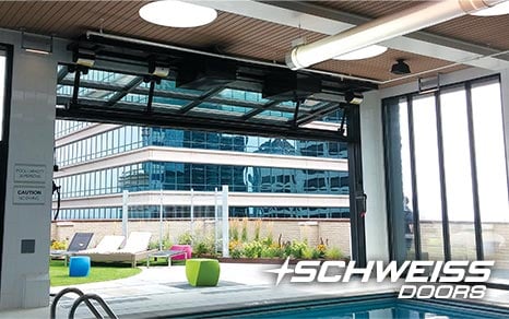 Schweiss poolside Designer Doors meets Green Building Standards.