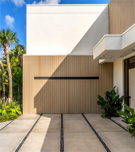 Hidden Schweiss hydraulic designer door installed on Barake designer home shown closed