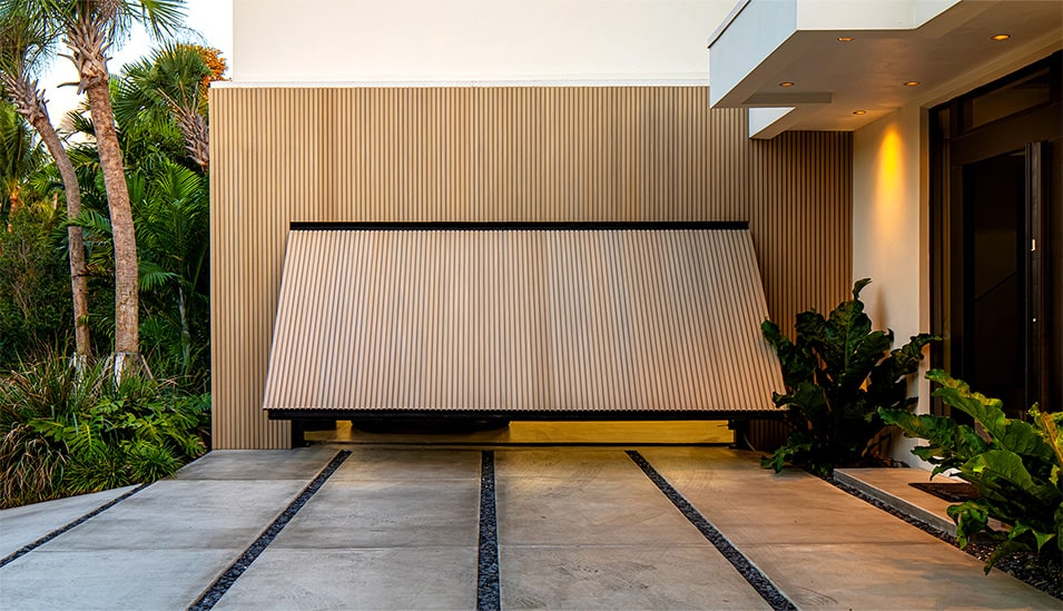 Hidden Schweiss hydraulic designer door installed on Barake designer home shown opening