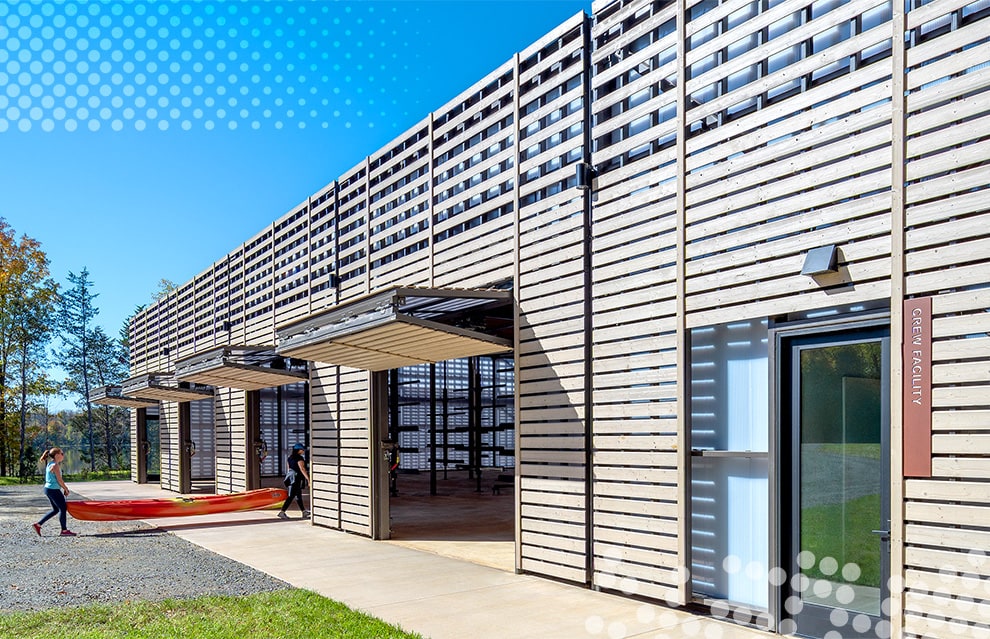 Exterior view of multiple Schweiss bifold doors fitted on storage/crew building at Beaverdam Reservoir Park shown open