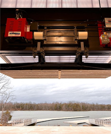 Closeup view of Schweiss top-drive motors used to lift the multiple Schweiss bifold doors fitted on storage/crew building at Beaverdam Reservoir Park