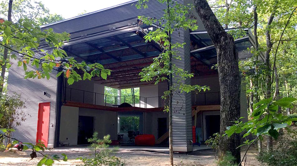 Exterior view of two open Schweiss glass bifold doors fitted on Blue Ridge Mountain Art Studio