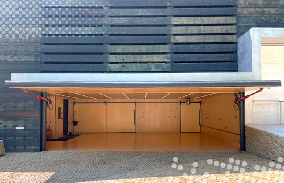 Exterior view of Schweiss hydraulic door fitted on Brad Mottier's home shown open