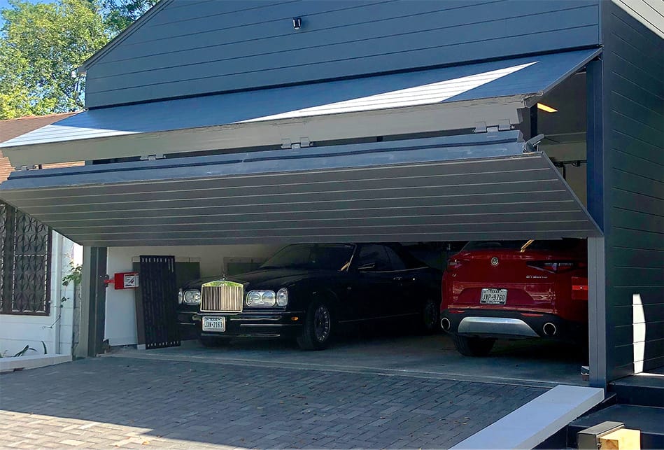 Custom Schweiss bifold door fitted on Braun's garage shown half-open