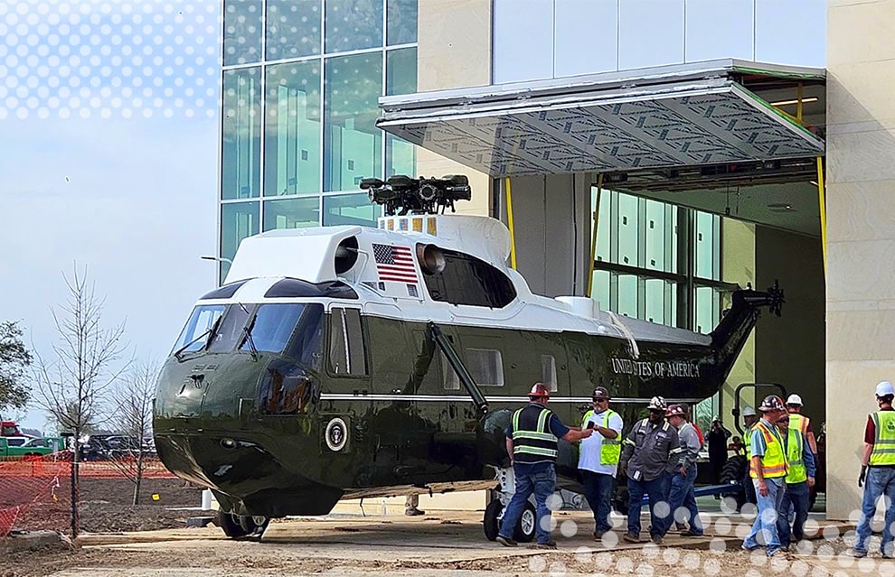 Iconic helicopter Marine One parked in front of Schweiss bifold door installed on George H.W. Bush Presidential Library and Museum