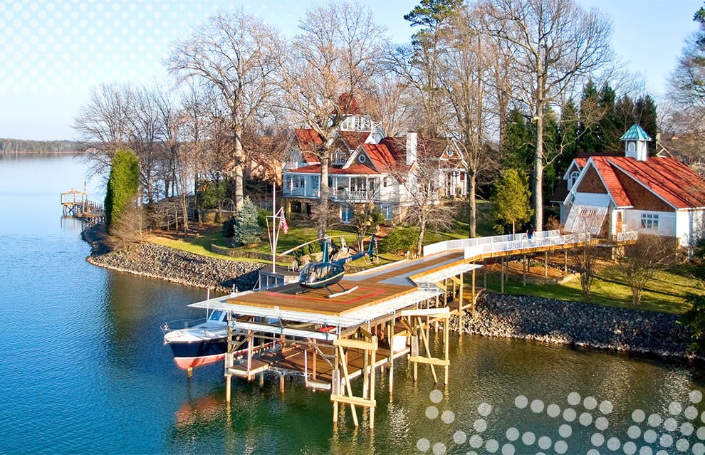 Carriage House lakeshore property with helicopter on pier