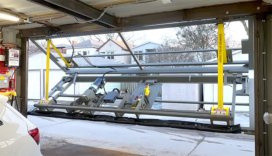 Interior view of Schweiss container door frame fitted on container garage shown opening