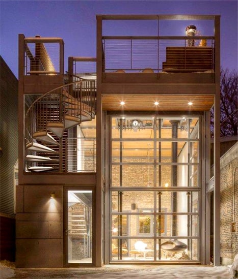 Exterior view of Schweiss bifold door fitted on renovated home by dSpace Studios shown closed