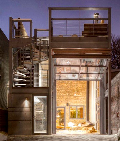 Exterior view of Schweiss bifold door fitted on renovated home by dSpace Studios shown open