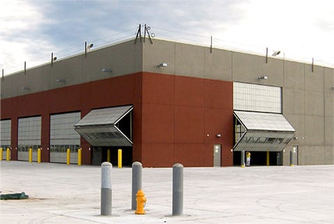 Distanced view of a building at Fort Carson fitted with multiple Schweiss bifold doors