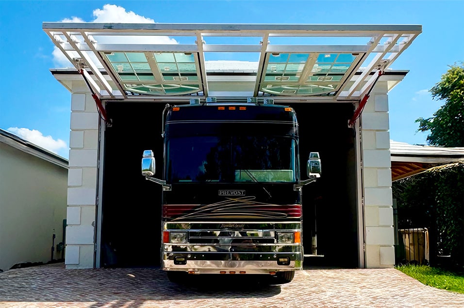 Exterior view from front of hidden Schweiss hydraulic door shown open on Frank Vital's RV garage in Fort Lauderdale
