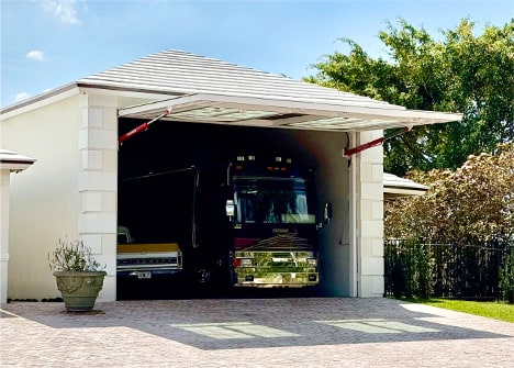 Exterior view from left of hidden Schweiss hydraulic door shown open on Frank Vital's RV garage in Fort Lauderdale