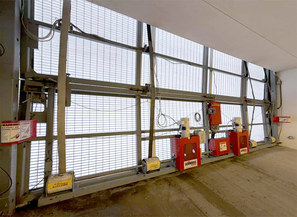 Schweiss bifold door installed on parking garage at Four Seasons Hotel Miami shown closed from inside