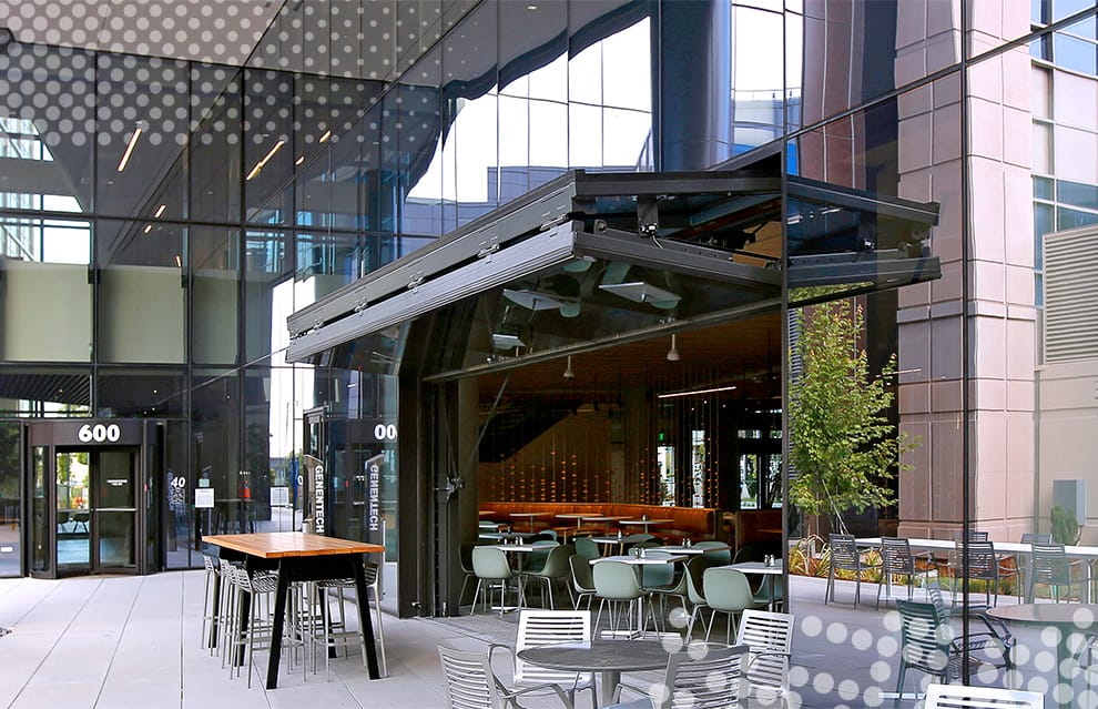 Schweiss glass bifold door fitted on Genentech Parmaceuticals building viewed from right side