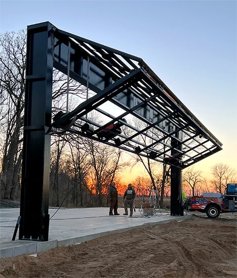 Exterior view of the Schweiss bifold frame during installataion on the goat farm