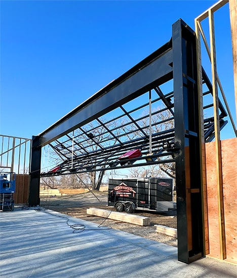 Interior view of the Schweiss bifold frame during installataion on the goat farm