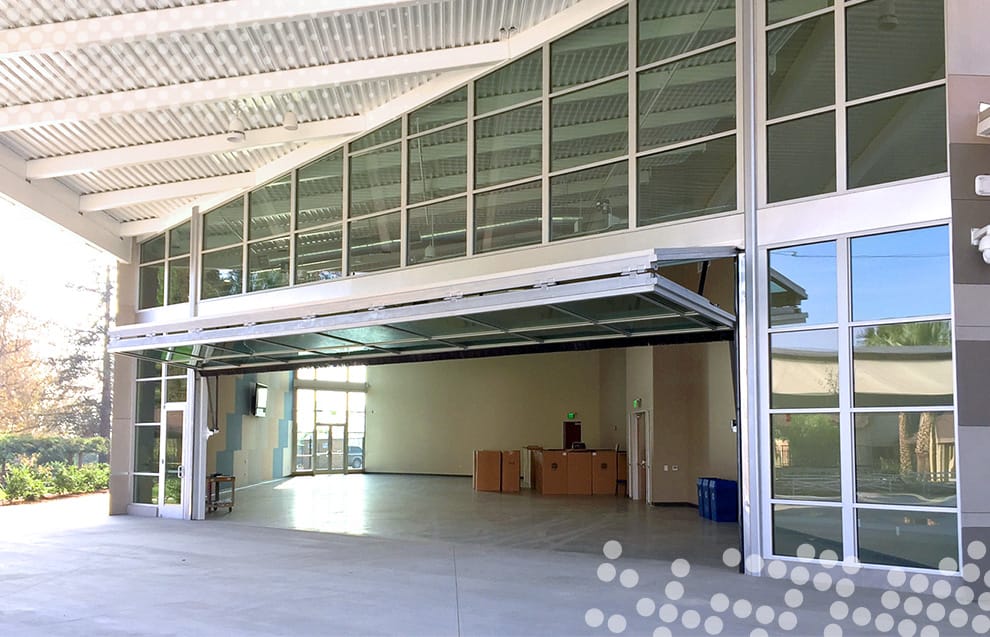 Schweiss bifold door installed on Guide Dogs of America's latest expansion in Sylmar, CA shown in the open position