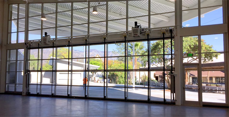 Interior view of Schweiss bifold door installed on Guide Dogs of America expansion shown in the closed position