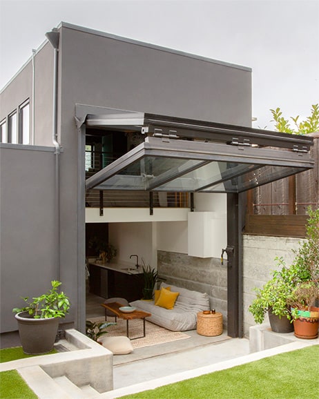 Exterior view of Schweiss bifold door fitted on designer home shown open