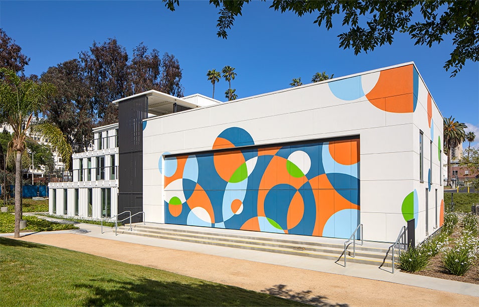 Exterior view of Schweiss bifold door fitted on HOLA's Clubhouse building shown closed