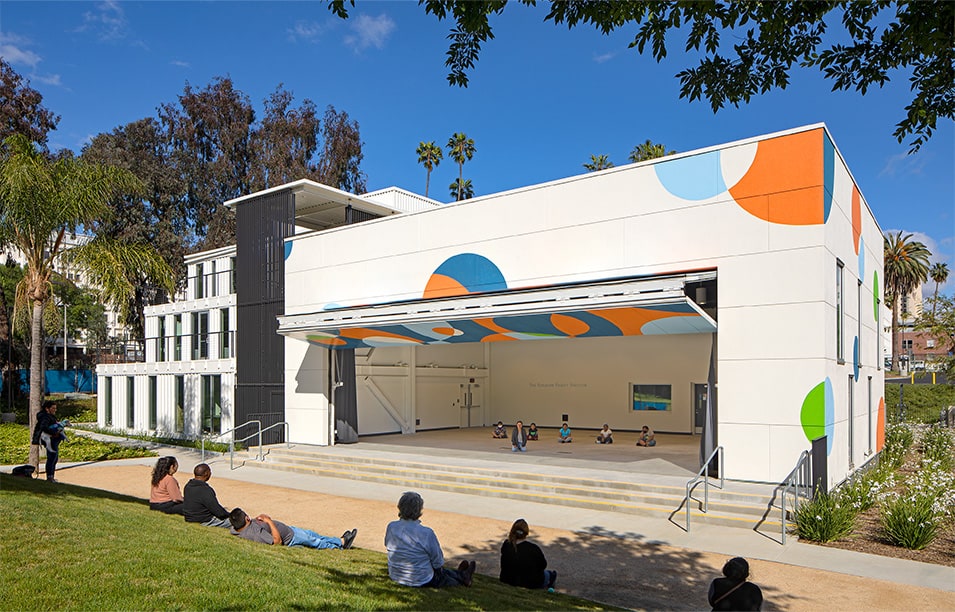 Exterior view of Schweiss bifold door fitted on HOLA's Clubhouse building shown open