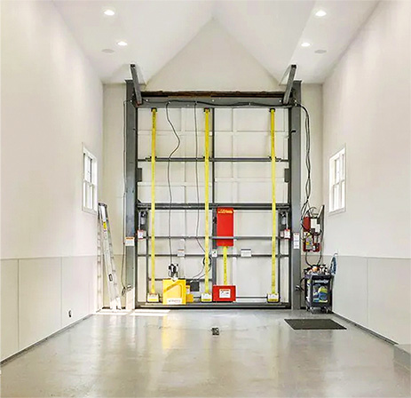 Interior view of custom Schweiss bifold door fitted on RV garage in North Oaks, MN