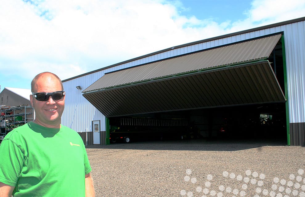 Huisman posed in front of one of his Schweiss bifold doors