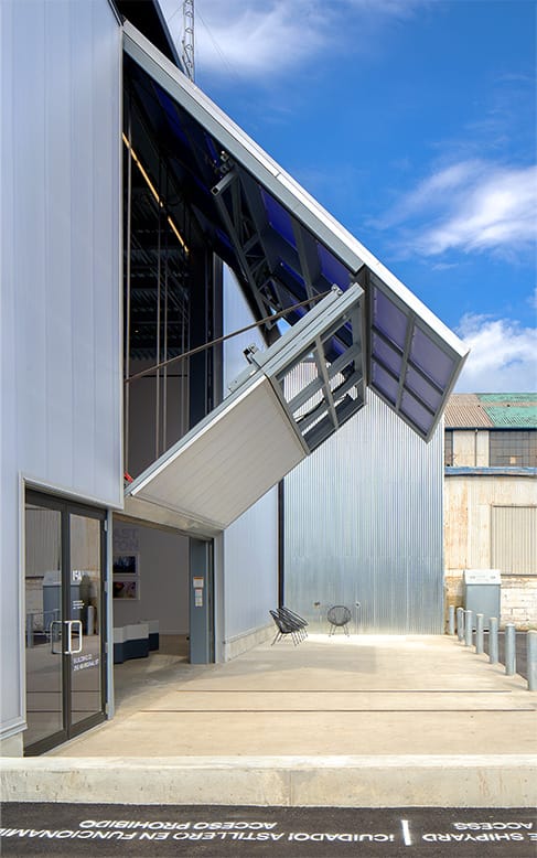 Side view of custom Schweiss bifold door fitted on water shed at Institute of Contemporary Art