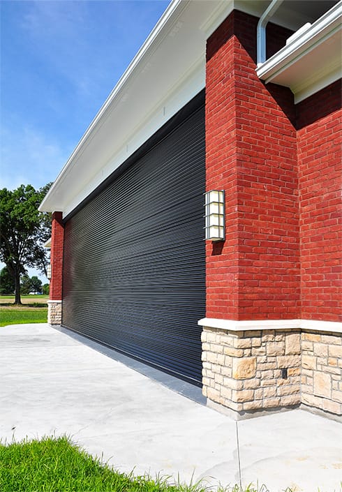 Side view of Schweiss bifold door installed on airpark hangar in Ohio owned by JT Strange shown fully closed