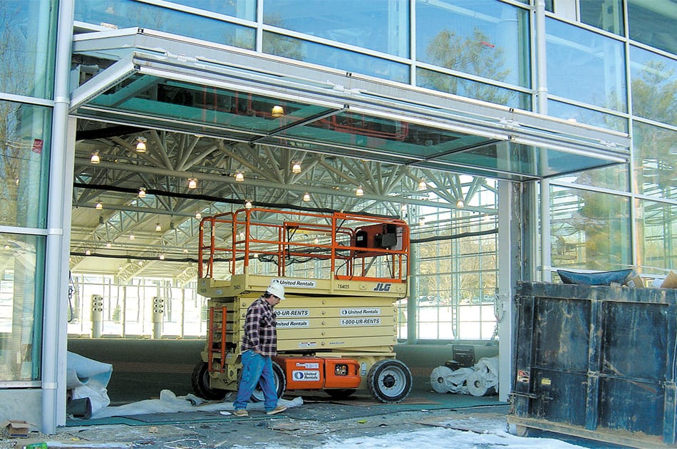 Custom Schweiss glass bifold door installed on Kenyon College's fitness center