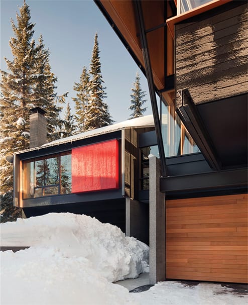 Angled view of Kicking Horse Ski Resort where a custom Schweiss hydraulic door with wood cladding is installed