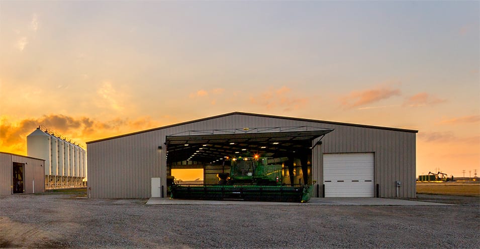 Distanced view of Schweiss hydraulic door fitted on a farm building installed by Koehn Construction