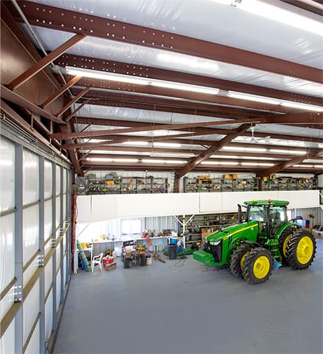 Interior view of Schweiss hydraulic door fitted on a farm building installed by Koehn Construction