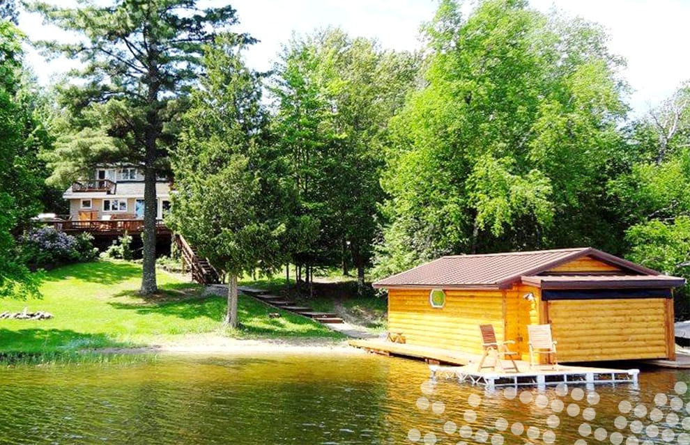 Schweiss hydraulic door shown closed fitted on boathouse over Lake Vermilion