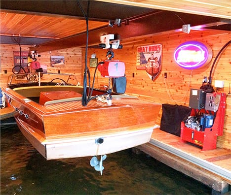 Interior view of boathouse on Lake Vermilion that is fitted with a Schweiss hydraulic door