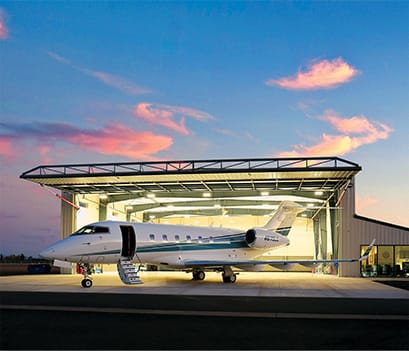 Schweiss hydraulic door on Lanz Hangar pictured in the evening