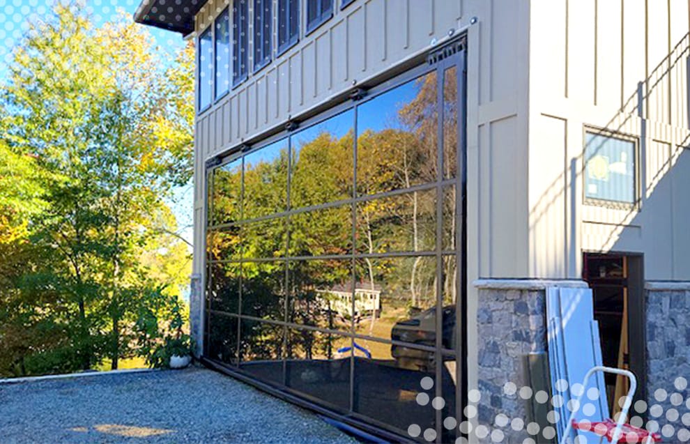 Custom Schweiss glass hydraulic door installed on Jeff LeVie's RV garage in North Carolina shown closed