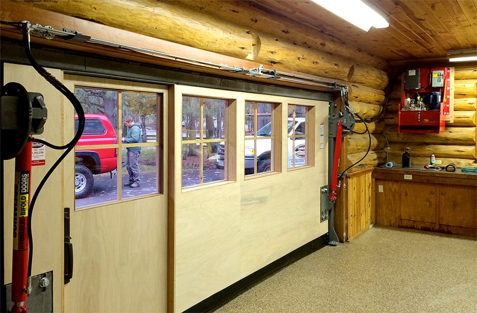 Interior view of custom Schweiss hydraulic door fitted on a Log Cabin in Oregon