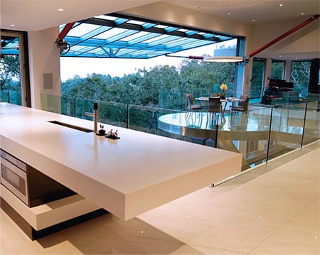 Interior view of Schweiss glass hydraulic door fitted on luxurious home shown open