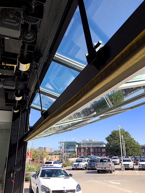 Interior view of Schweiss glass bifold door fitted on Mercedes-Benz Dealership in St. Louis in the open position