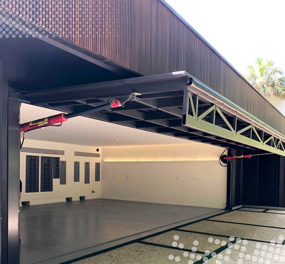 Schweiss hydraulic door shown open on residence in Miami, Florida