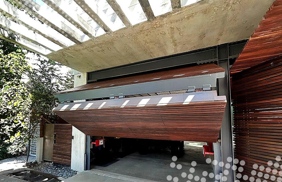 Schweiss bifold designer door fitted on contemporary home in Miami shown opening from the front