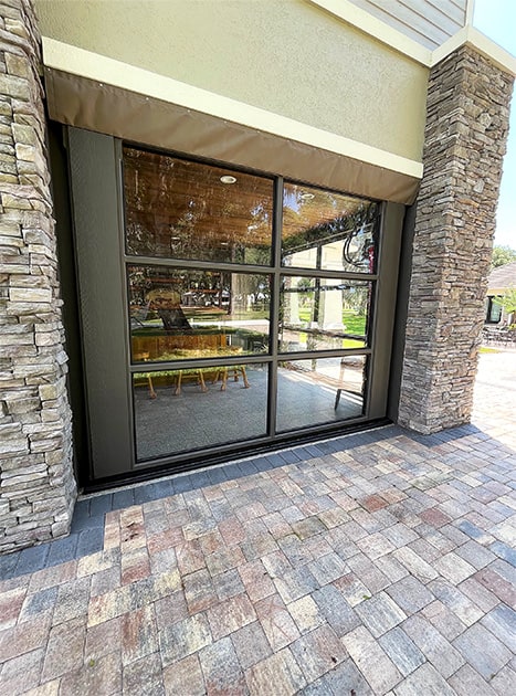 Schweiss glass hydraulic doors fitted on Mount Royal Airpark hangar in the closed position viewed from outside