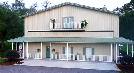 Frontal view of a custom Schweiss hydraulic door with an attached porch shown closed