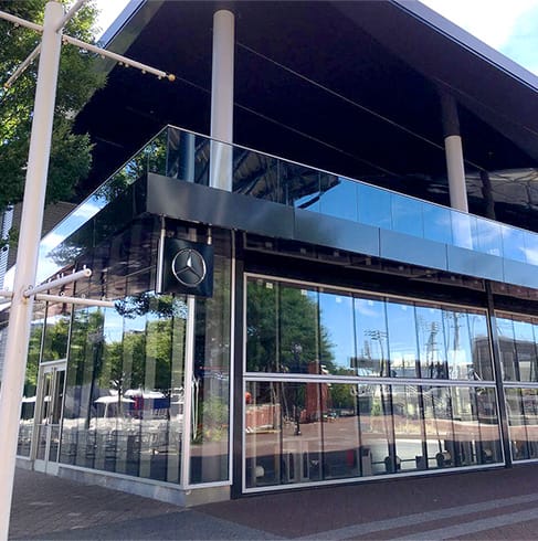 Schweiss bifold doors with glass cladding fitted on Billie Jean King National Tennis Center