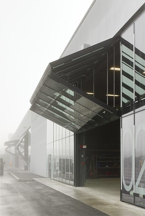 Side view of custom Schweiss glass bifold door installed on new Operations HQ in Newmarket, Ontario