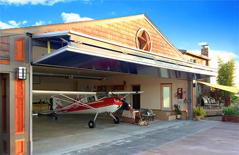 Schweiss bifold door installed on Oregon Star Hangar shown fully open