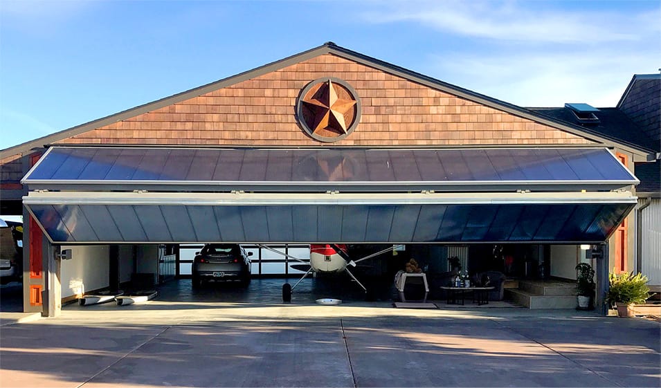 Schweiss bifold door installed on Oregon Star Hangar shown half open