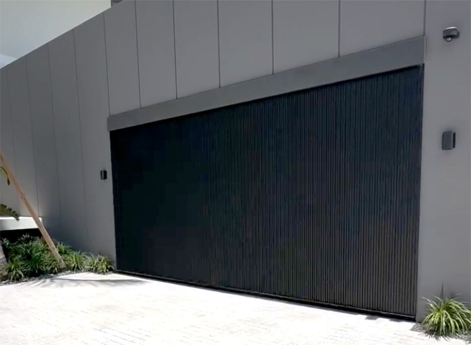 Schweiss hydraulic door fitted on Pro garage in Florida shown closed